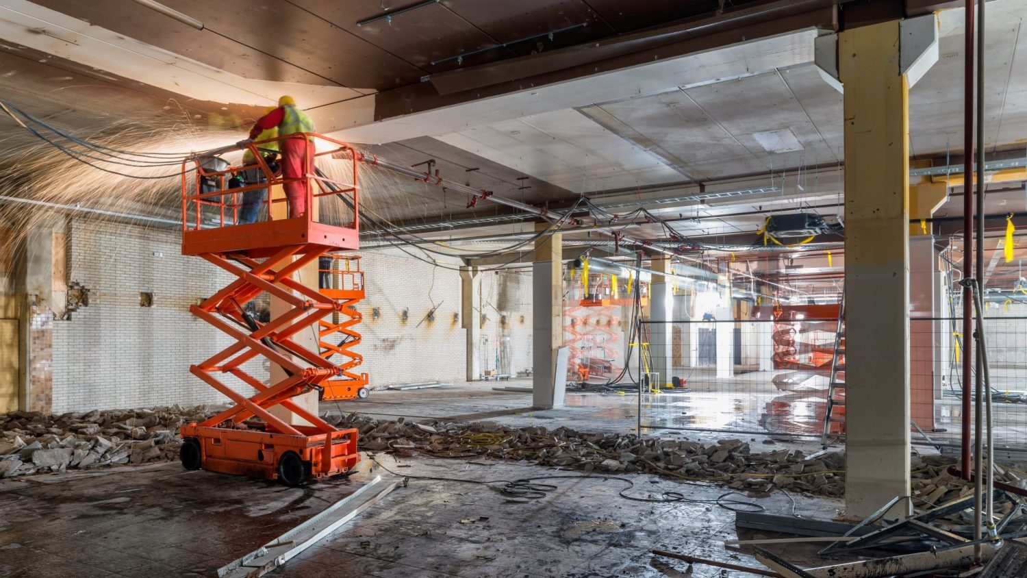 Operator following OSHA regulations for scissor lifts