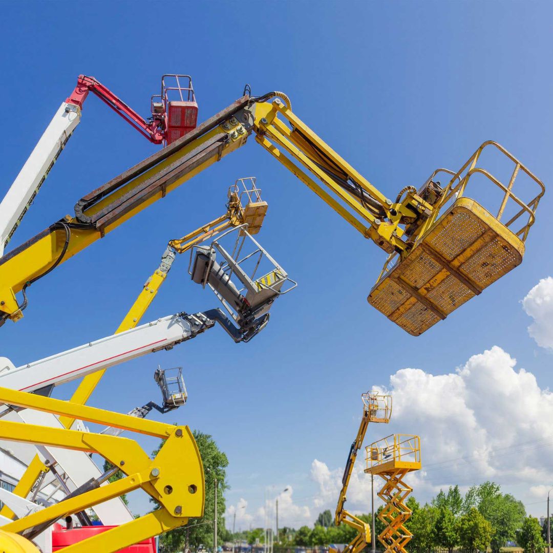 close up of telescopic boom lifts being used outdoors